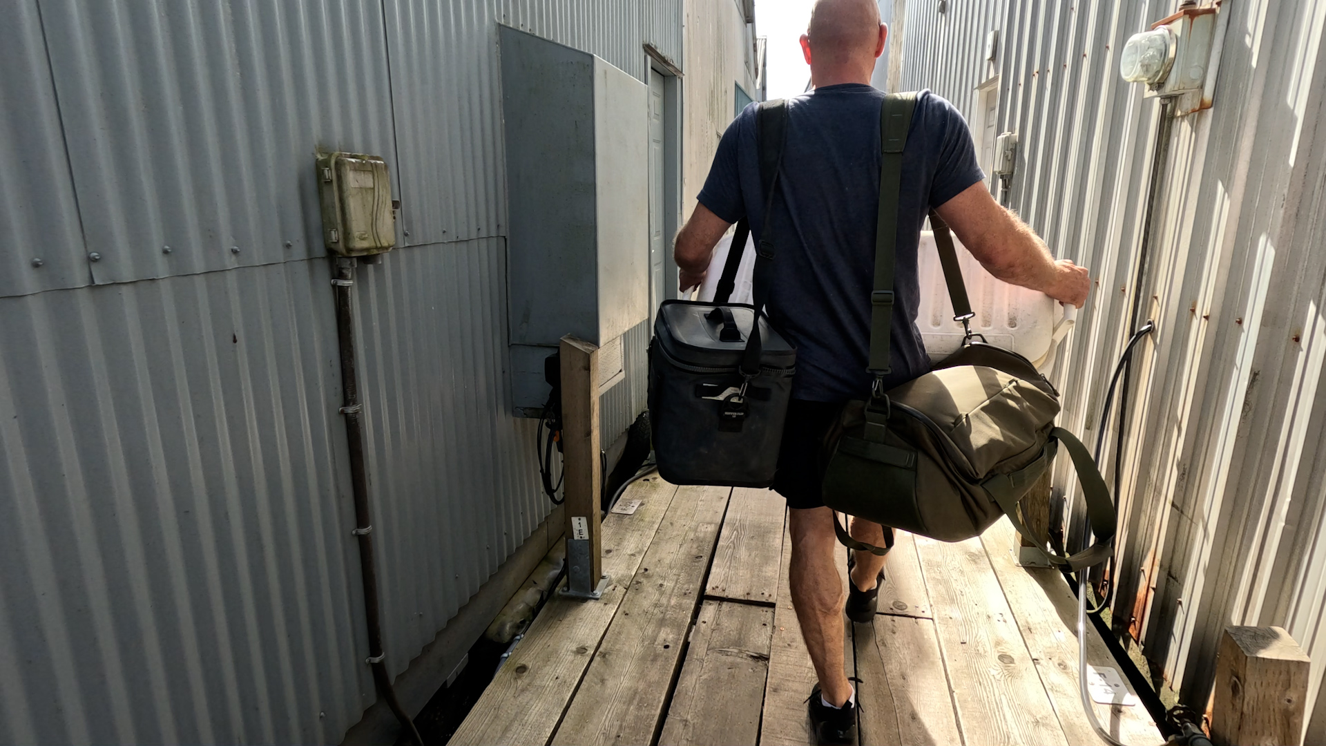 Carrying bags down to the dock before departure