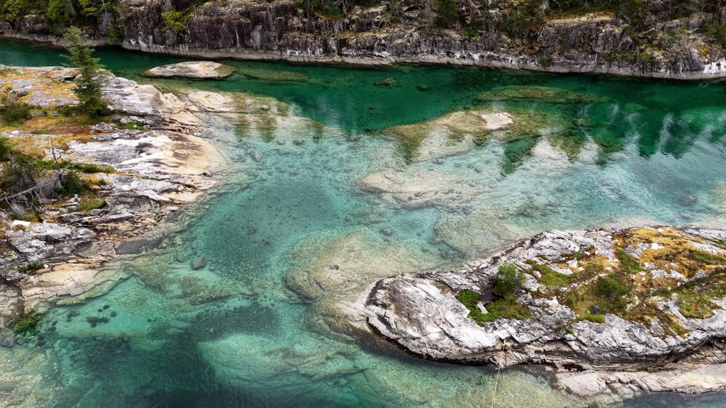 Turquoise water over a rocky reef, one of our favorite anchorages