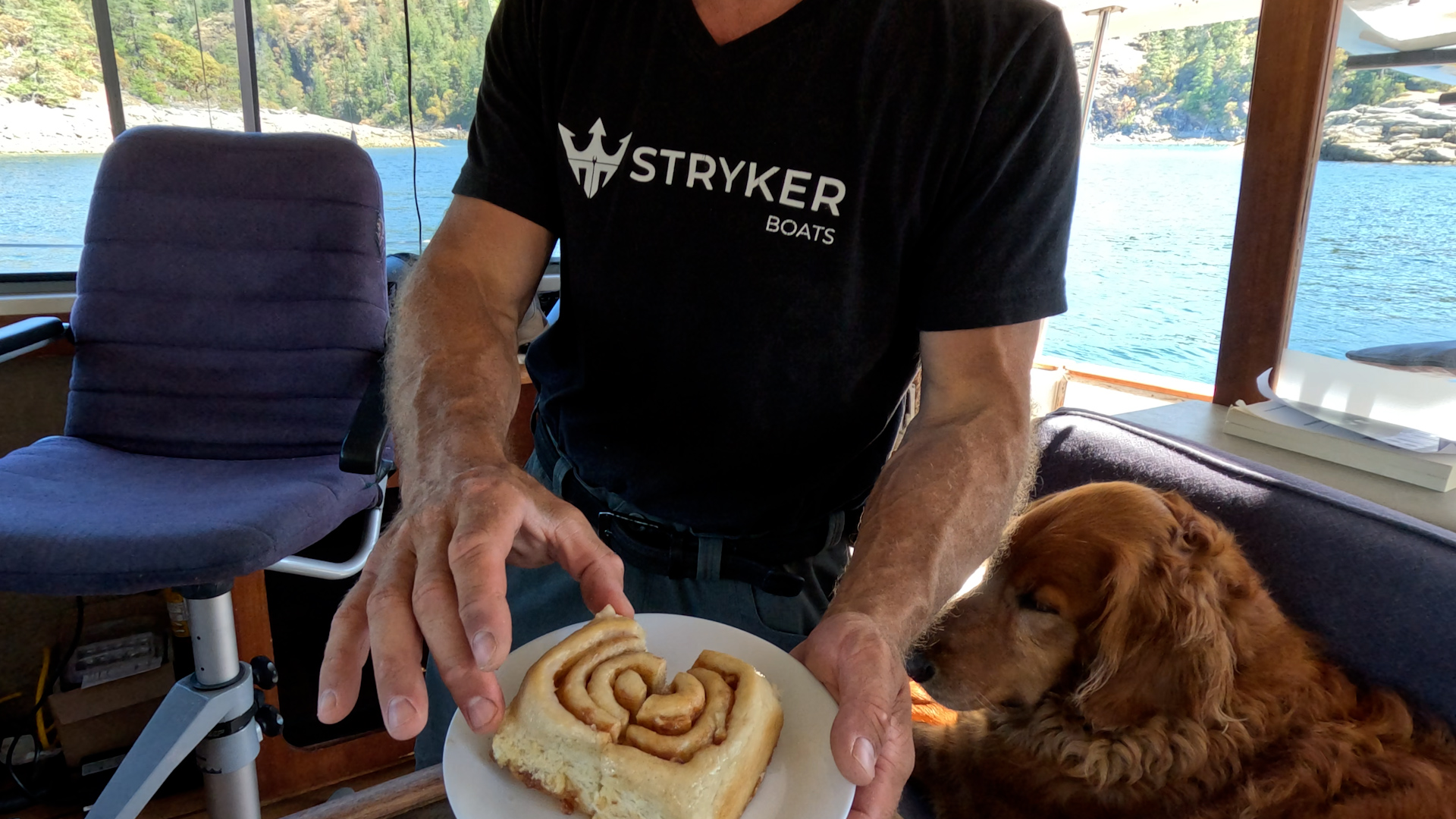 Cinnamon bun from Nancy's Bakery aboard the boat with our dog