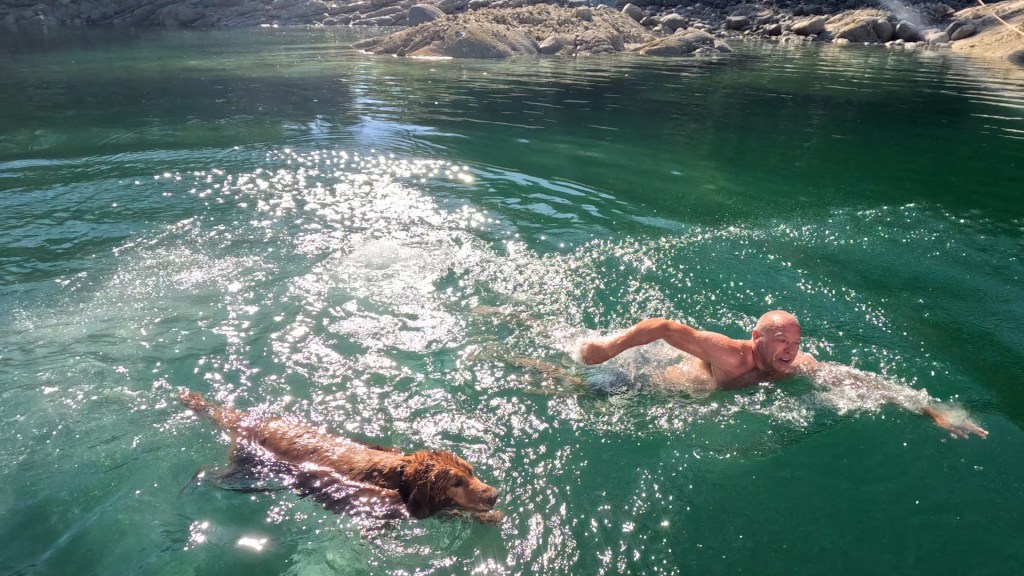 Swimming in the warm water of Laura Cove