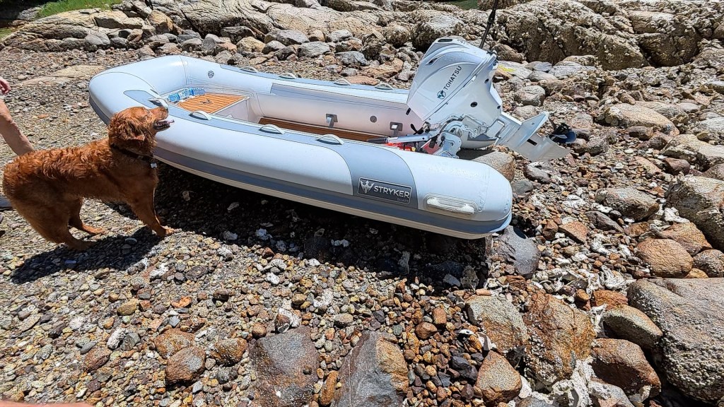 Our tender stranded high on the beach after the tide dropped