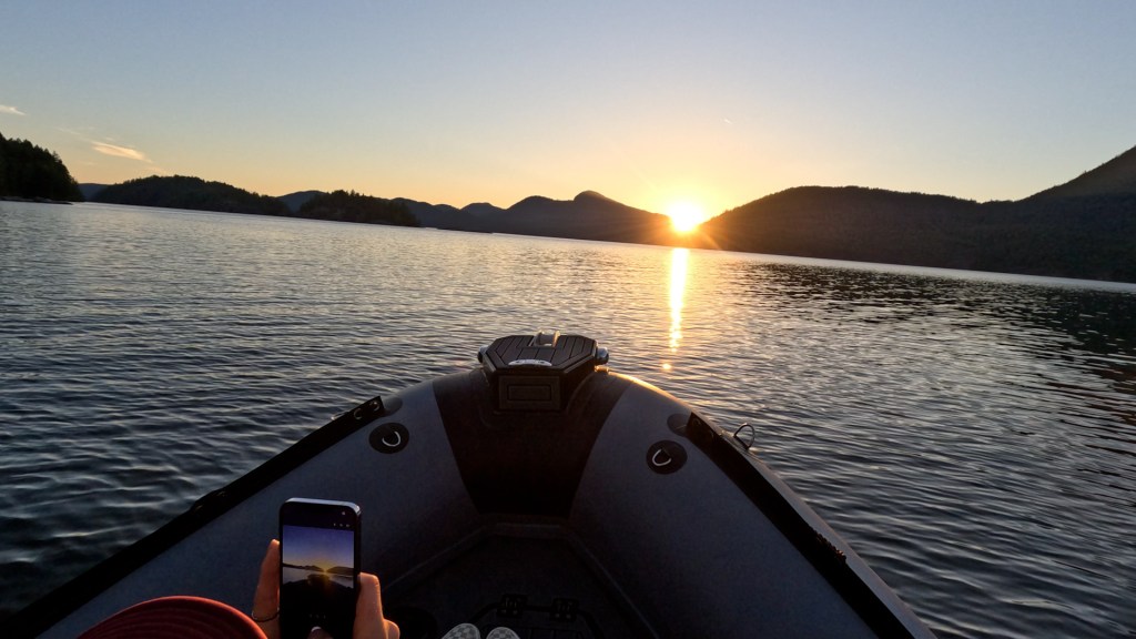 Sun setting behind the mountains over Desolation Sound