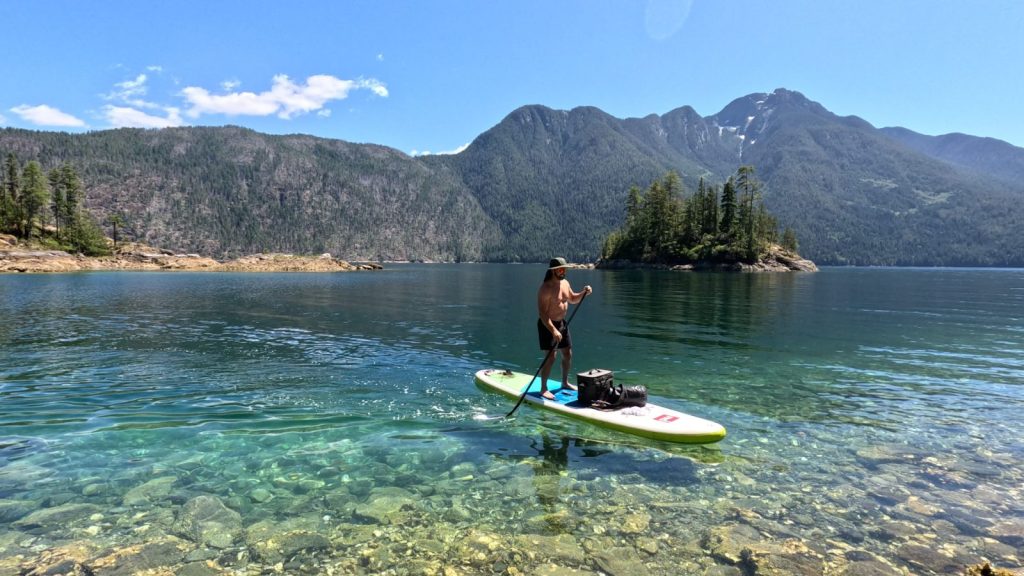 Paddleboarding over clear water in Pendrell Sound