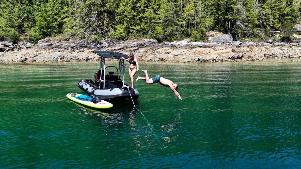 Diving off the Stryker RIB 470 into the warm water of Pendrell Sound