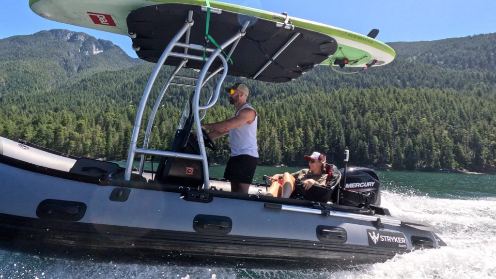 Stryker RIB 470 with a paddleboard on the T-top running through Desolation Sound